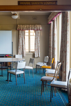Scattered chairs in empty chalet room