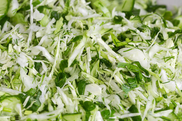 Fototapeta premium Heap of green vegetable salad, close-up in selective focus