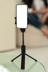Blank smartphone tripod setup for content creation. Device is isolated for mockup or presentation use in digital projects.
