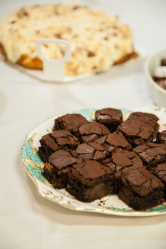 Chocolate brownie slice on a plate set out for a party