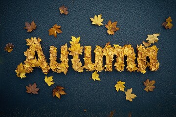 Yellow autumn leaves arranged around wooden letters with the inscription "autumn" on a black background. 