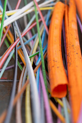 Colorful Cables and Conduits After Rain – Construction Site Close-Up
