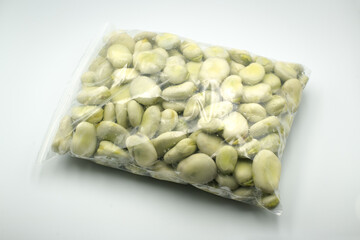 Broad beans in a plastic bag.
