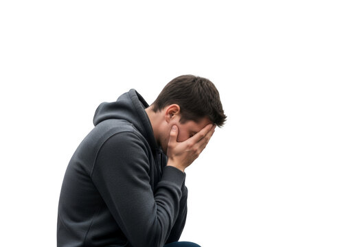 Depressed man hiding face in hands, sad person suffering from grief, lonely man in hoodie on white background