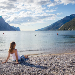 Woman meditating at the lake