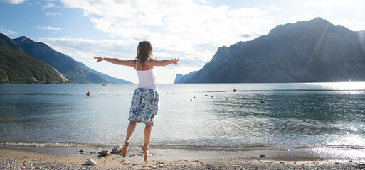 Woman jumping at the lake