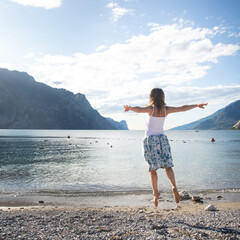 Woman jumping at the lake