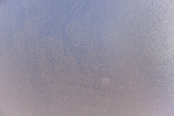 A thick layer of frost on the glass makes it completely opaque and opaque.