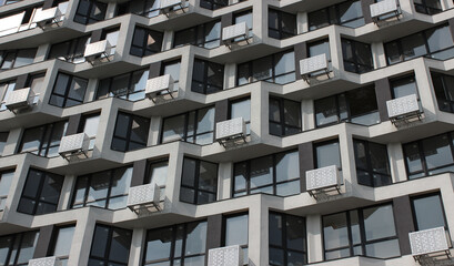 Backdrop Of Same Balconies On The Facade Of Modern Multi Storey Apartment Building. Architectural Details of Modern City House