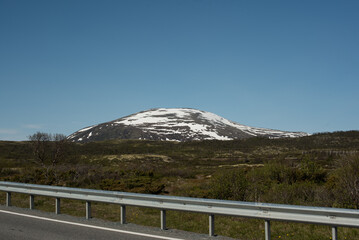 Road through the snowy mountain in Norway