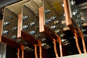Close-Up of Electrical Busbars with Bolted Connections in Industrial Equipment