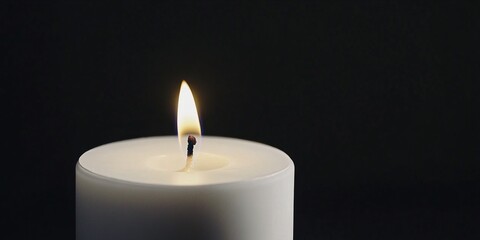 Single Candle Flame on Black