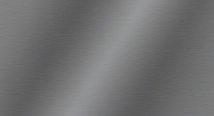 A close-up of a brushed metal surface showing subtle light reflections and a gradient of gray tones.