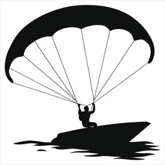 Silhouette of a person parasailing over a boat/A dramatic silhouette of a person parasailing over a boat on calm water.