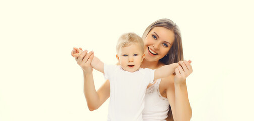 Happy cheerful smiling mother holding baby, joyful young mom and little child on white background
