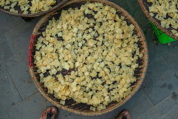 Sun-Drying Square Rice Sheets or Root Chips in Southeast Asia