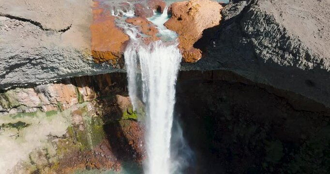 Epic waterfall falling from rocky cliff volcanic mountain. Salto del Agrio, Neuquen, Argentina