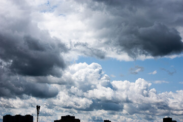 Dark storm clouds with rain. Storm clouds of various soft shapes in the sky. Changeable weather....