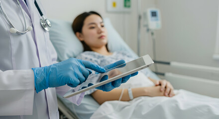 Doctor using tablet to examine patient in hospital bed healthcare medical technology digital health consultation medicine hospital room patient care diagnosis treatment