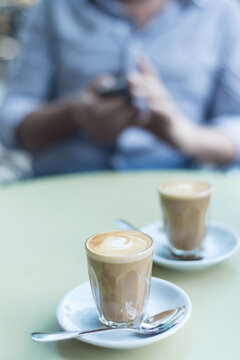 Piccolo latte coffees on a table at a cafe in the morning