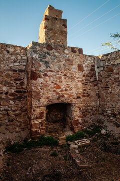 abaonded stone building with chimney but no roof