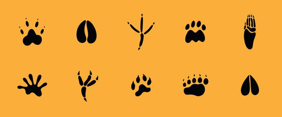 Paw print silhouette. Isolated paw print on orange background