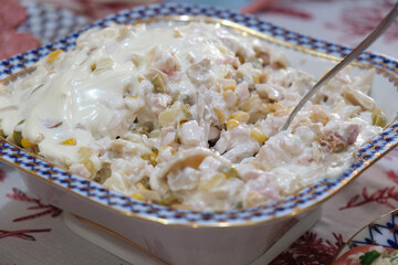 Festive dish with salad on a set table. Concept of family feast, celebration, joyful dinner, party