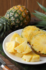 Close Up of Fresh Honey Pineapple with Juicy Yellow Flesh on Rustic Background