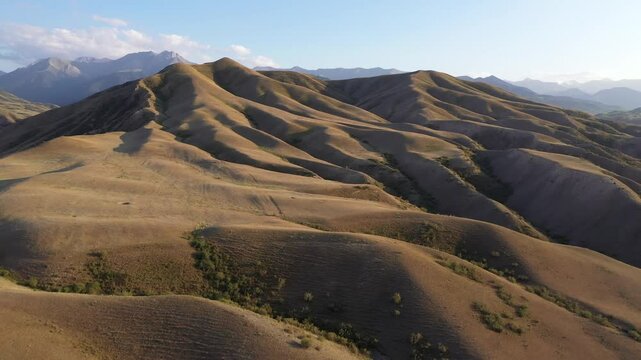 Aerial view of rolling hills and mountains, Kazakhstan.