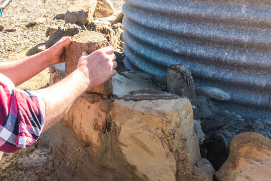 Laying rocks to create a wall