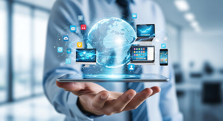 Businessman holding a tablet displaying a digital globe with connected devices and technology icons symbolizing global connectivity