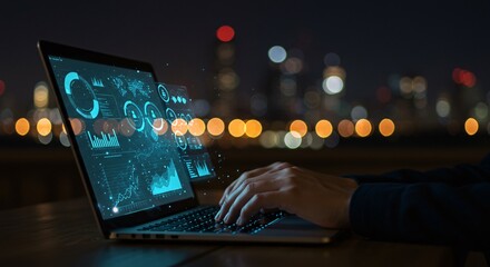 Person working on laptop with futuristic data analytics interface at night