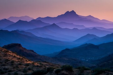 Remote ridge outline at sunset with colorful mountain layers  
