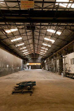 Disused factory space showing a vast empty warehouse