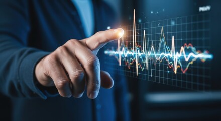Finger touching data graph on screen showcasing stock market analysis
