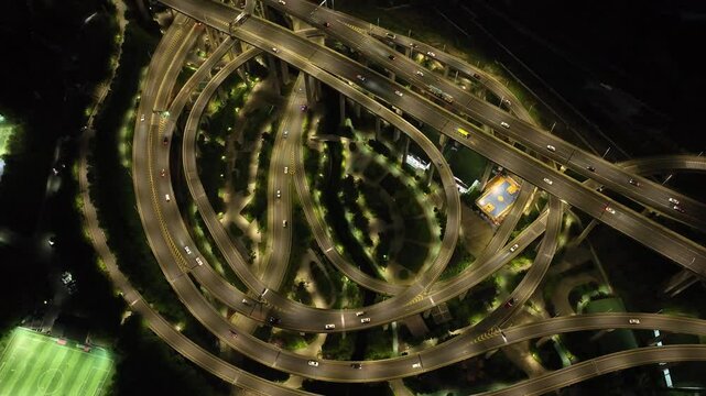 Aerial view of illuminated highway interchange, China.