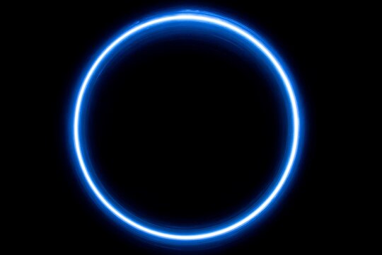 Chic black background with blue circular frame accent  
