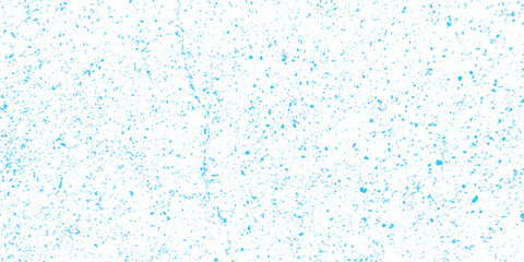 Abstract background with scattered blue watercolor paint splatters creating a textured decorative pattern for artistic designs and digital creative projects