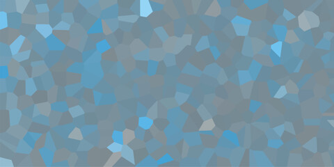 Textured surface made of irregular geometric shapes patterned in shades of blue and gray creating a harmonious aesthetic