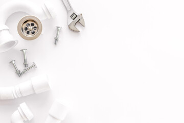 Plumber profession with gear and instruments for repair tubes on white background top view copyspace