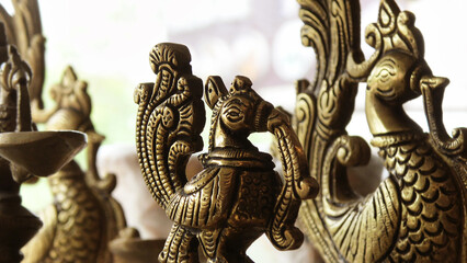 In a handicraft shop, displaying decorated peacock sculptures