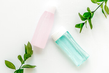 Organic cosmetics for face clearing with facial tonic and mycelial water on white background top view copy space