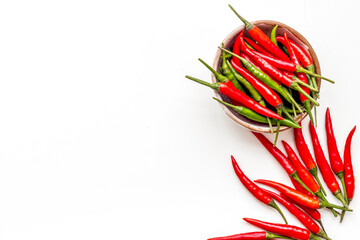 Fresh red and green chilli pepper as food ingredient on white table background top view mockup