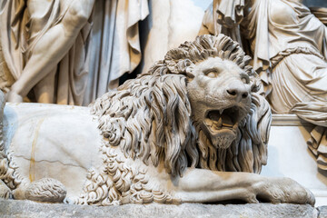 Old marble statue of lion opening its mouth