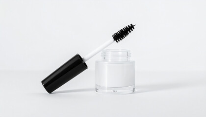 Minimal glass container of brow gel with brush applicator. Cosmetic product.