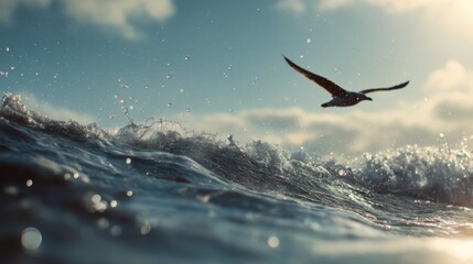 Obraz premium Seabird flying over ocean waves under a bright sky