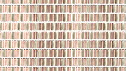 A glass of orange juice with sliced oranges and green leaves on a white background in a studio shot