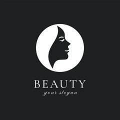 Minimalist beauty salon logo with woman face silhouette