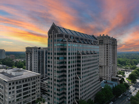 Aerial drone photo of One Buckhead Plaza.  Beautiful colored sunset adorns the towering One Buckhead Plaza