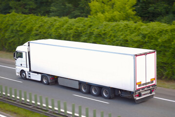 White Cargo Semi-Trailer Truck in Motion – Sustainable and Efficient Freight Transport